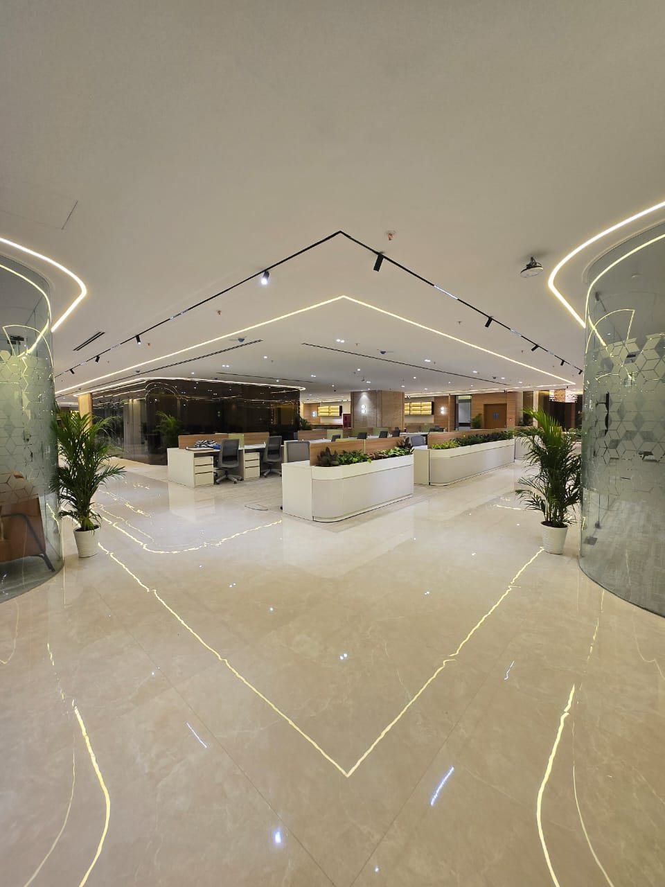 Marble-finished reception hall with a wood-panelled feature wall